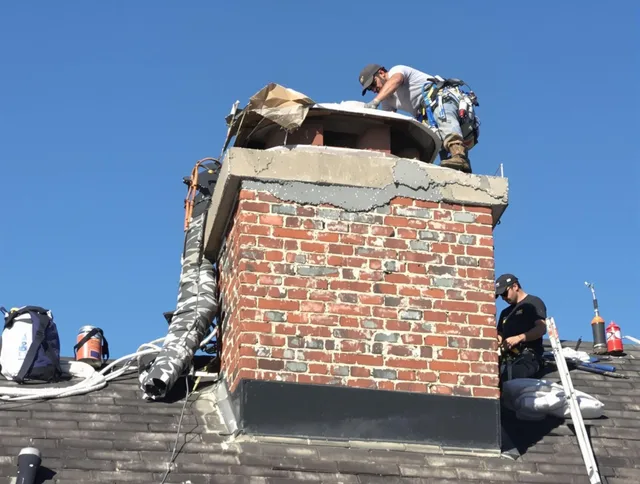 Winchester Chimney Sweep installing a custom chimney crown in Winchester, MA