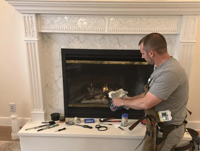 Winchester Chimney Sweep performing fireplace maintenance in Winchester, MA