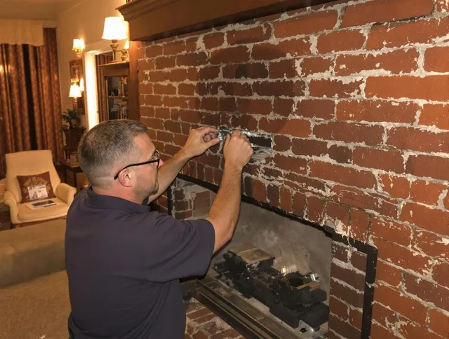 Winchester Chimney Sweep expert fixing a fireplace in Winchester, MA